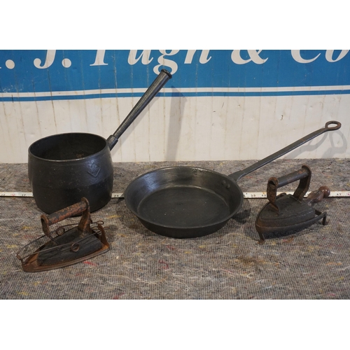 63 - 2- Cast iron pans and 2 cast iron irons