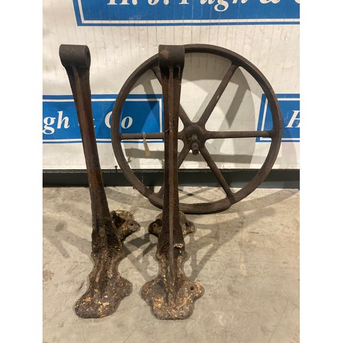 1344 - 2 Cast iron stands and wheel