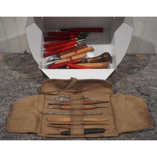 478 - Box of craft knives, lino cutters and military roll of craft tools