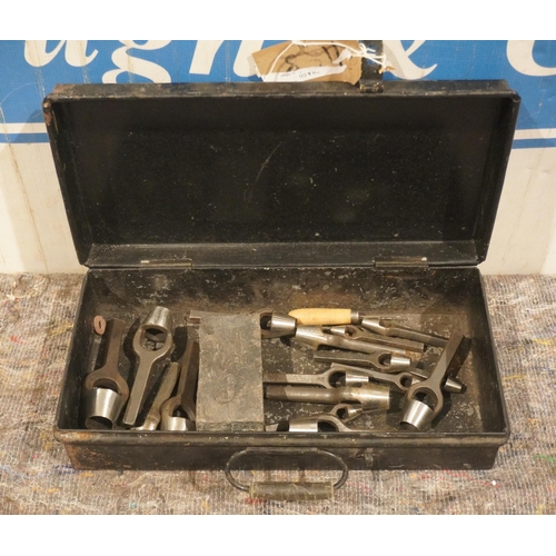 511 - Tin box of wad punches, lead cutting block and 17 Prioriy leather cutting punches