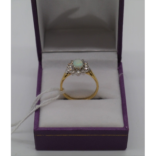 478 - 18ct Gold, diamond and opal ring. Size N