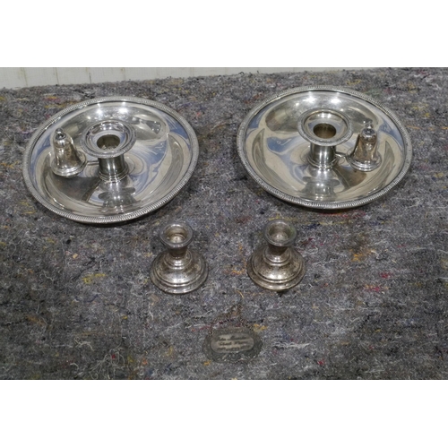 493 - Pair of silver plate candle holders, pair of silver candle sticks and silver decanter label