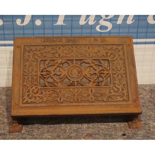 484 - Cast iron barber shop foot rest by Osborne Garrett