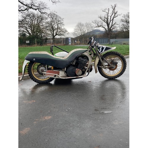 815 - Suzuki 1000cc Wasp grass track motorcycle. Fitted with side car c/w spare parts. No docs