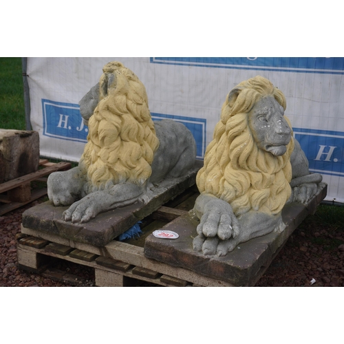 292 - Pair of lion ornaments