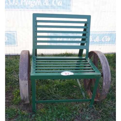 87 - Single seat bench with old cast iron wheels