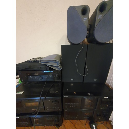 125C - 4- CD changers, amps and speakers to include cinema amp and surround sound