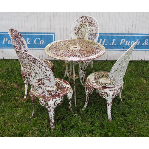 677 - Metal garden table and chairs