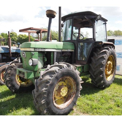 1453 - John Deere 2650 tractor. 4WD. Runs and drives. Broken cab glass. Rear wheel weights