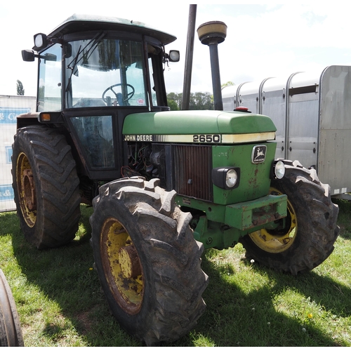 1453 - John Deere 2650 tractor. 4WD. Runs and drives. Broken cab glass. Rear wheel weights