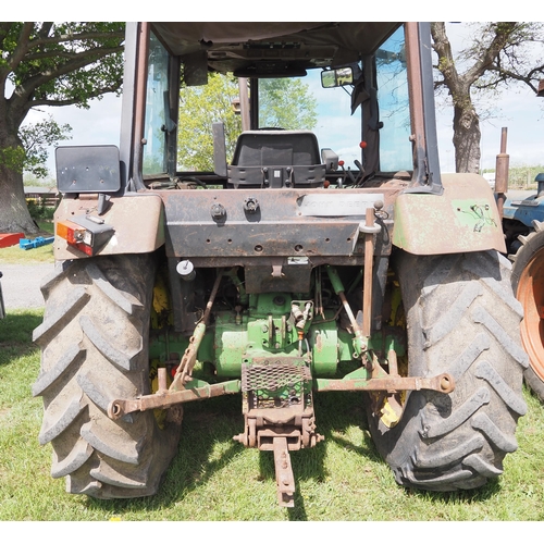 1453 - John Deere 2650 tractor. 4WD. Runs and drives. Broken cab glass. Rear wheel weights