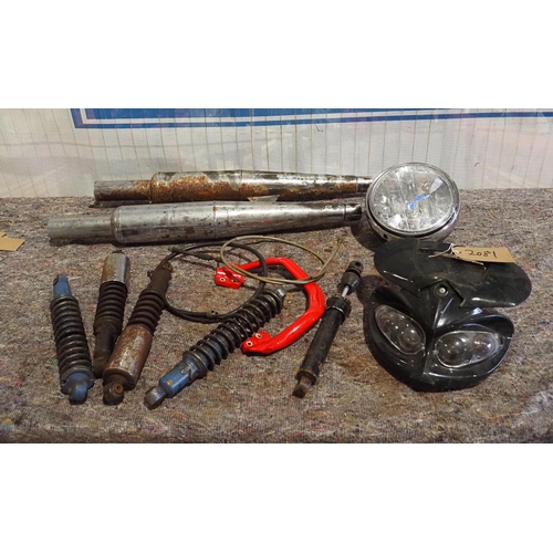 791 - Assorted motorcycle spares to include headlight, exhausts, shocks etc