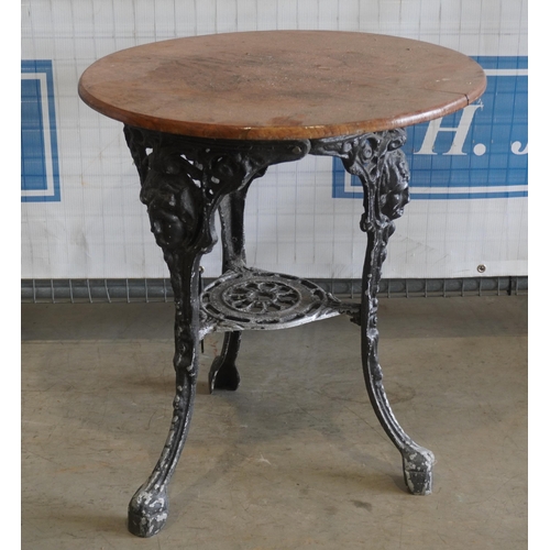 145 - Circular pub table with cast iron base 24