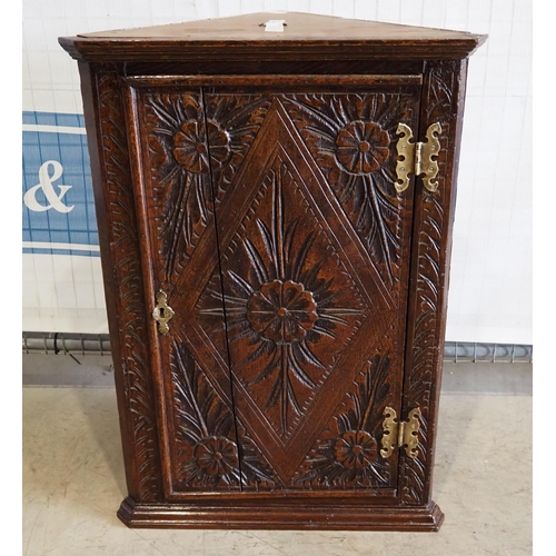 136 - Carved corner cupboard with key 32