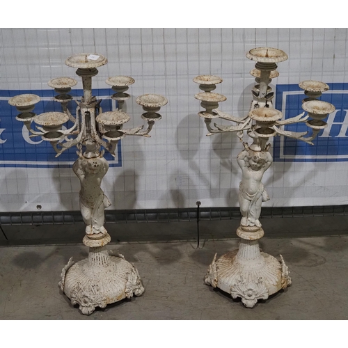 564 - 2- Cast iron garden candle stick holders 32