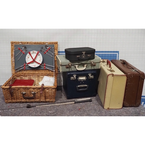 529 - Picnic hamper and assorted old suitcases