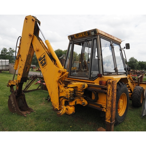 1987 - JCB 3CX-4 digger, back hoe, buckets and pallet tines. working H317 EAY