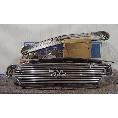 249 - Assorted Morris Oxford chrome wheel trims, front grilles, headlight surrounds etc