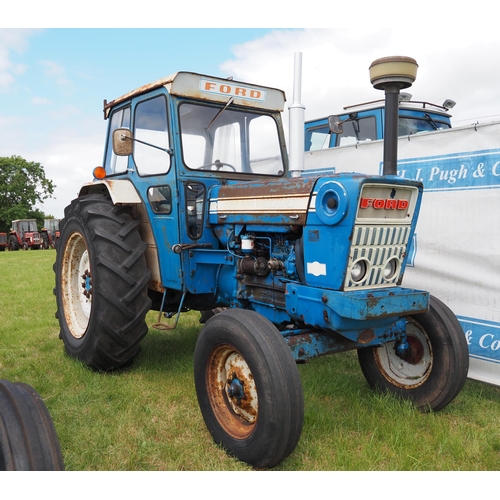 323 - Ford 7000 tractor. 1975. With Fieco cab. Runs and drives. Owned by the same owner since 1990 in Glou...