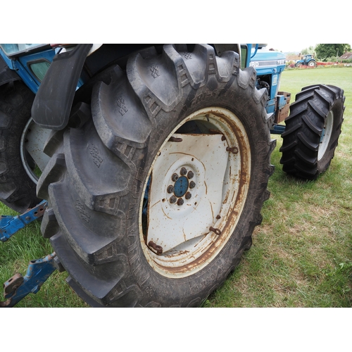 338 - Ford 7810 tractor. 1989. Runs. 7821 hours recorded. 4WD. Good all round tyres. C/w front weights and... 