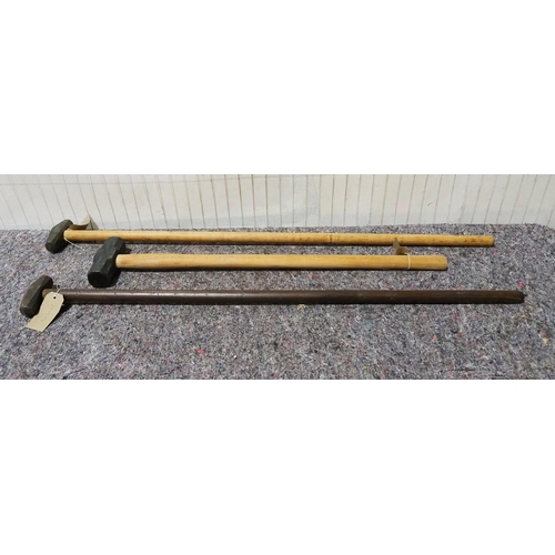144 - 2- Long handled military wheel inspection hammers and one other