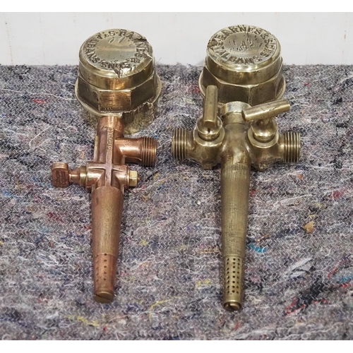 250 - 2- Brass vintage wheel nuts and 2 brass beer taps