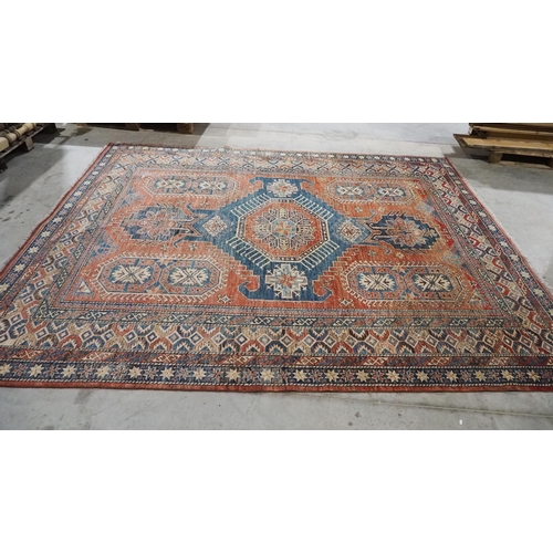 135 - Red and blue patterned wool rug 125-120