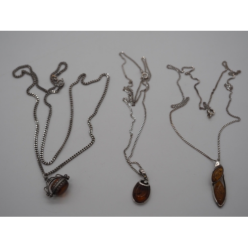 312 - 3- Silver amber pendants on silver chains