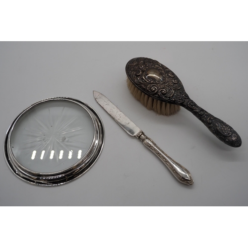 386 - Hallmarked silver hairbrush, knife, silver and glass bottle coaster