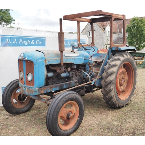 411 - Fordson Super Major tractor. safety frame. Runs.  Reg 676FMJ