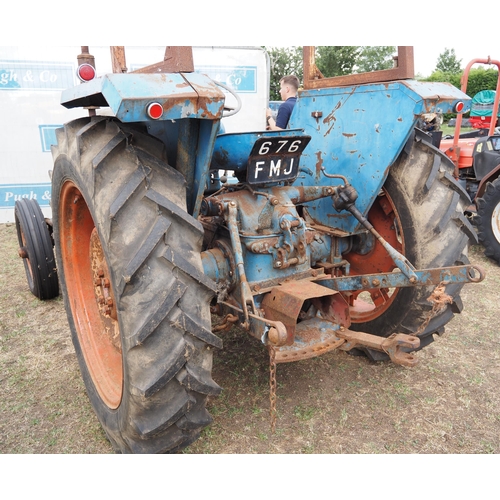 411 - Fordson Super Major tractor. safety frame. Runs.  Reg 676FMJ