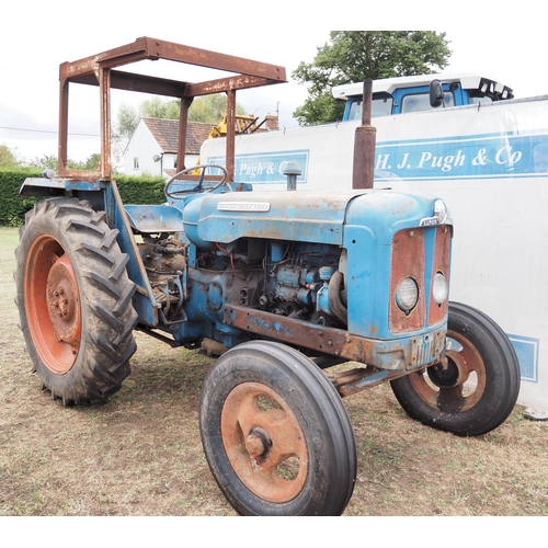 411 - Fordson Super Major tractor. safety frame. Runs.  Reg 676FMJ