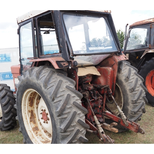 414 - International 784 tractor. Runs and drives. 5214 hours recorded. c/w pick up hitch