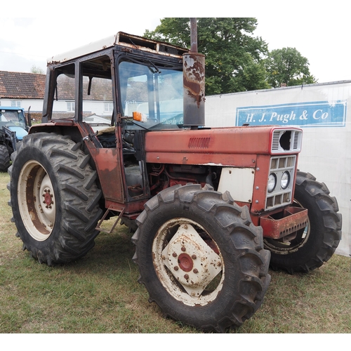 414 - International 784 tractor. Runs and drives. 5214 hours recorded. c/w pick up hitch