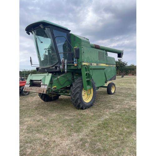 184 - John Deere 1055 combine. c/w 12ft header and trolley. Used this season. Reg J58 GPX. V5