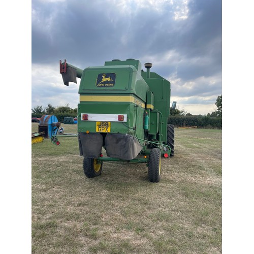 184 - John Deere 1055 combine. c/w 12ft header and trolley. Used this season. Reg J58 GPX. V5