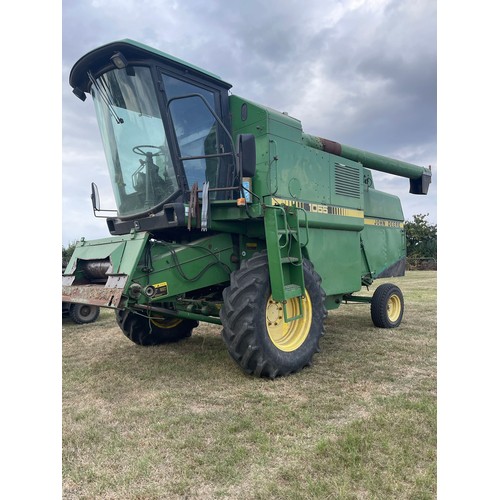 184 - John Deere 1055 combine. c/w 12ft header and trolley. Used this season. Reg J58 GPX. V5