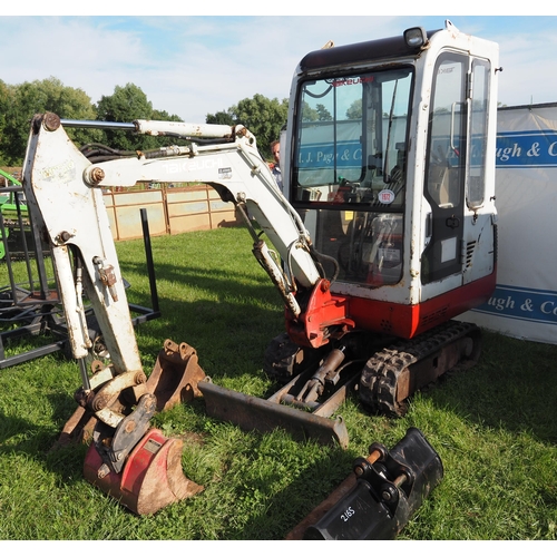 1972 - Takeuchi mini digger with 4 buckets. Running and working. No plate