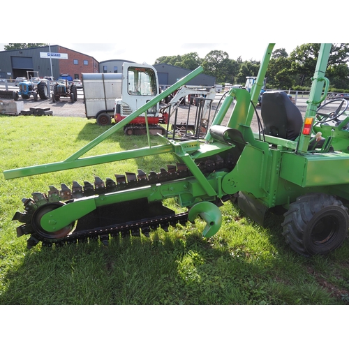 1973 - Vermeer wheeled trencher with blade and road cutting attachment and spare chain. refurbished, good w... 