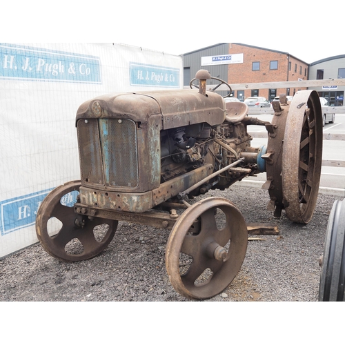 791 - Fordson E1A petrol paraffin tractor. Runs & drives. Fitted with steel & spade lug wheels & belt pull... 
