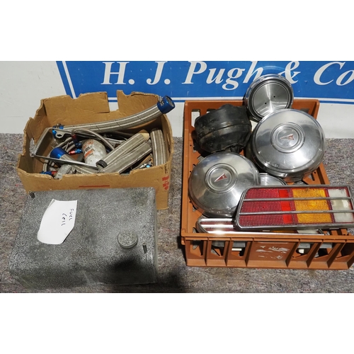 108 - Assorted American car hoses, hub caps and fuel tank etc.