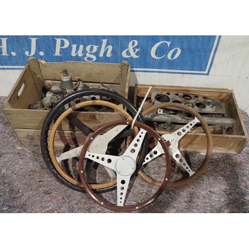 174 - Assorted car steering wheels, carburettor parts and manifolds etc.