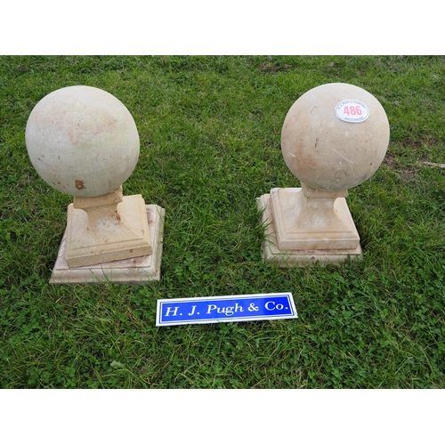 486 - Pair of stone pillar ball caps