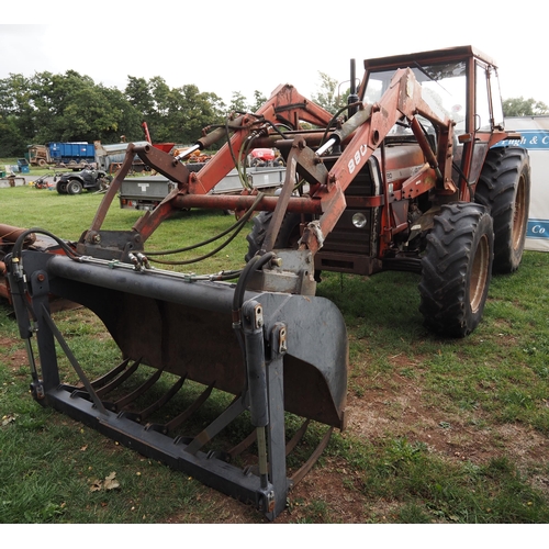 1768 - Massey Ferguson 290 4WD tractor. Showing 7470 hours. Runs and drives. Massey Ferguson loader, bucket... 