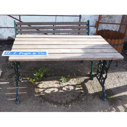 251 - Garden table and bench with cast iron base