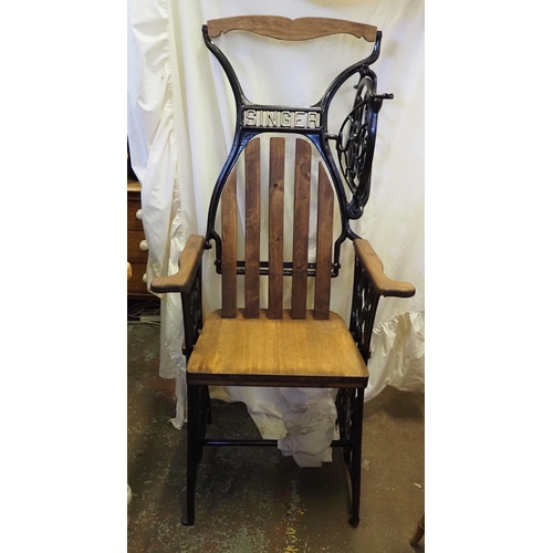 32 - Cast iron and oak Singer arm chair