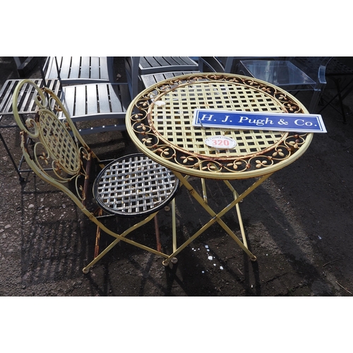 320 - Metal garden table and matching chair