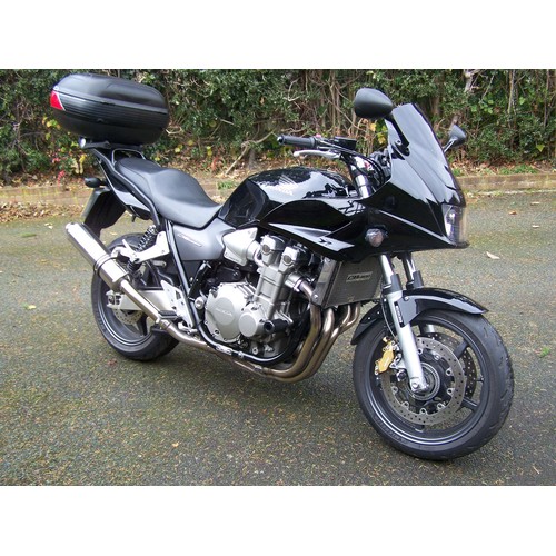 1062 - Honda CB1300 motorcycle. 2007. Runs and rides well. Givi Maxia top box and original silencer. Comes ... 