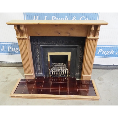 729 - Wooden and cast iron fire surround and hearth