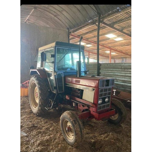 124B - International 724 tractor. 1980. Deluxe cab. C/w loader. 6318 hours recorded. Key in office. V5